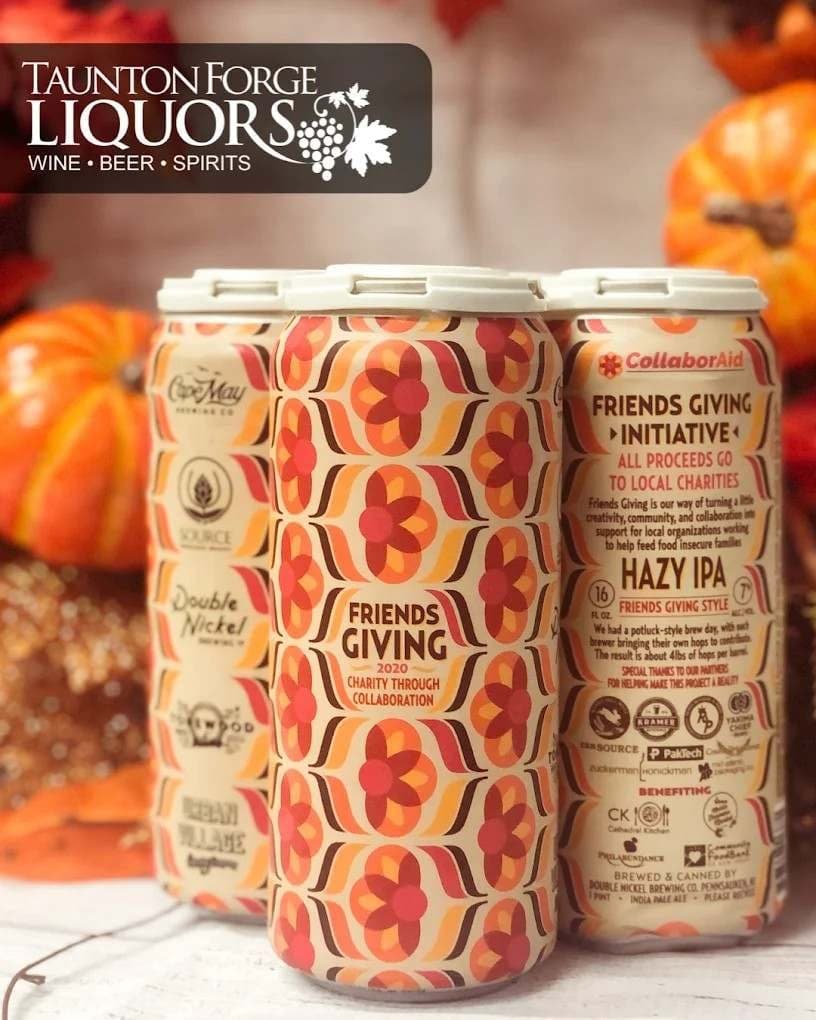Autumn display of craft beer cans among pumpkins