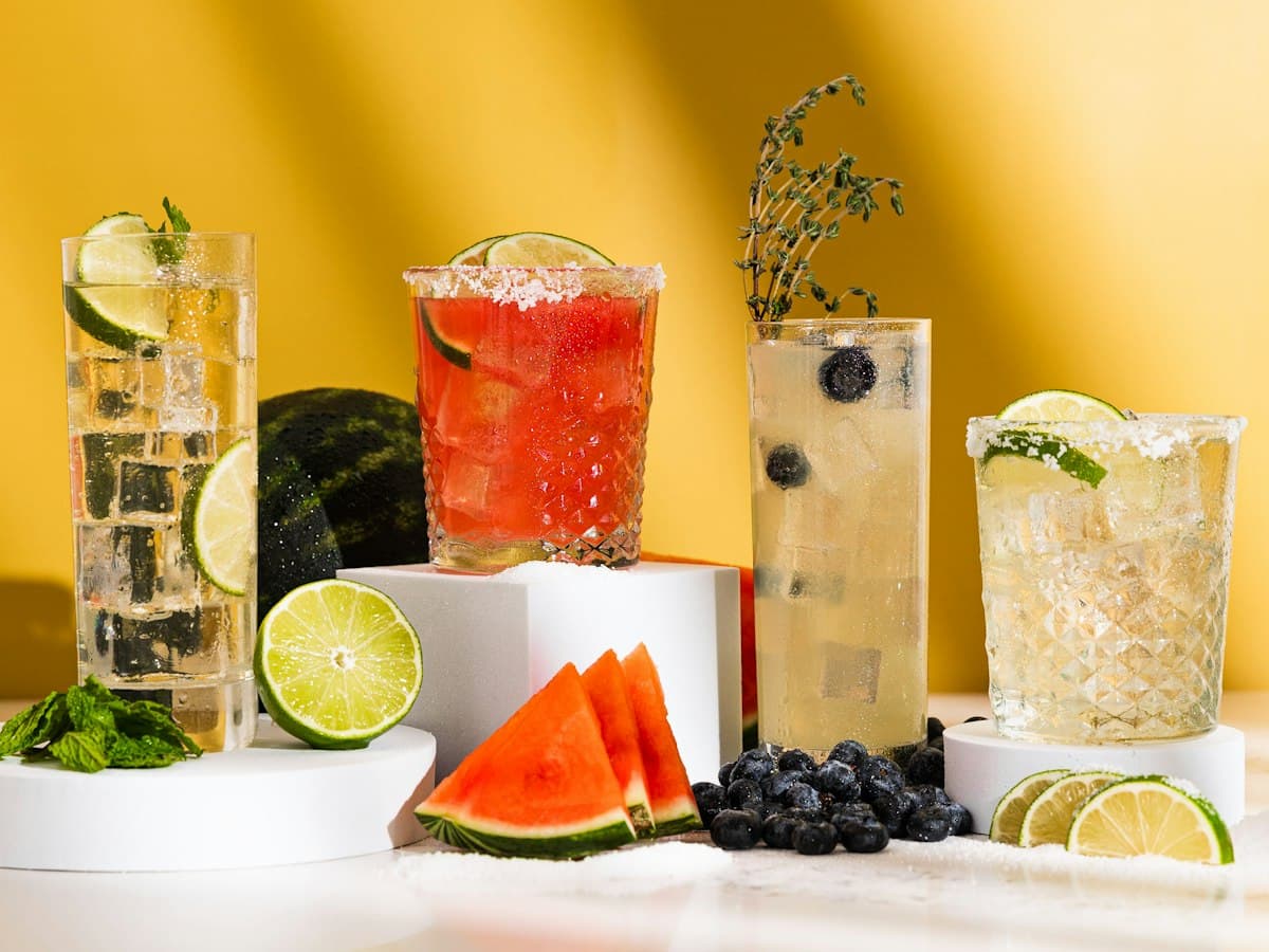 Colorful mocktails with fresh fruit and herbs
