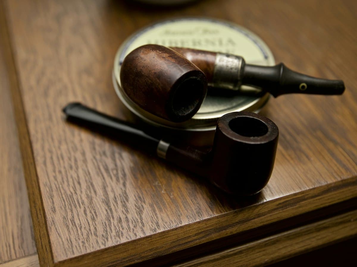 Tobacco pipes and a tin of pipe tobacco